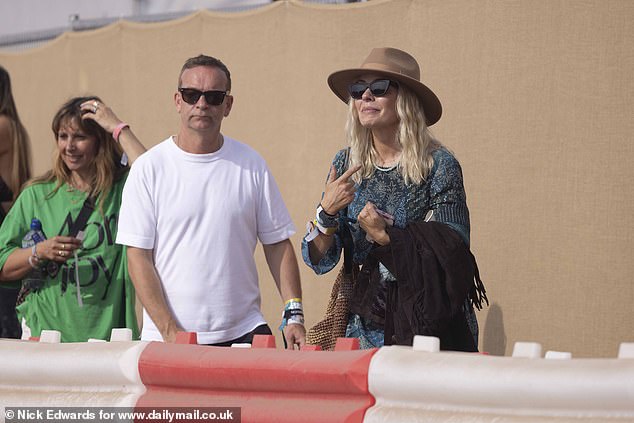 Holly was snapped alongside her TV executive husband Dan Baldwin as they enjoyed a child-free weekend together on Worthy Farm