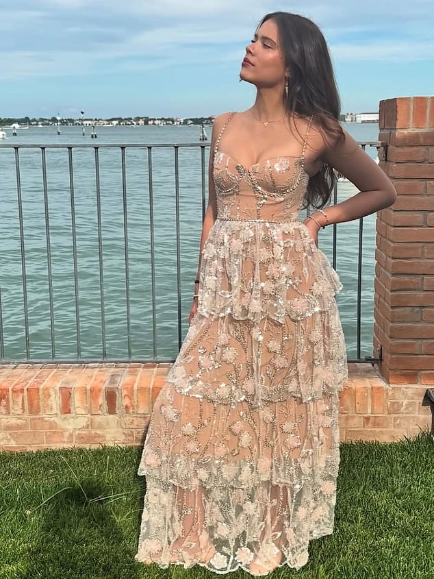 In photos shared on Instagram, the young adult upstaged her mom as she modeled a nude-toned beaded dress with a tiered skirt