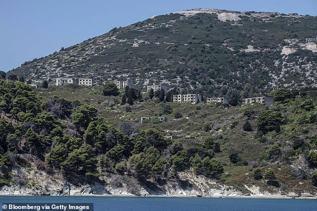 Pictured: Rows of what was once military barracks dot the coastline of Sazan to this day
