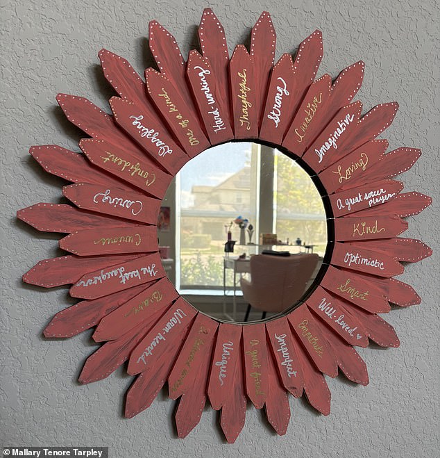 Pictured: The wooden mirror that Tarpley made for Madelyn surrounded by empowering words about her personality, not her looks
