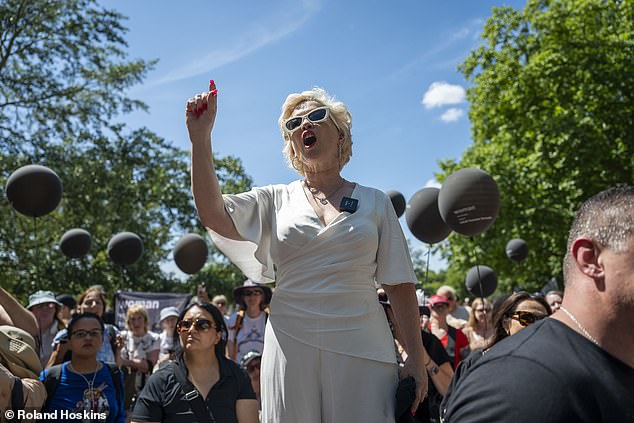Stopping at the popular Speaker's Corner area, Ms Keen pulled out a white ladder to stand in front of the crowd, stating: 'what we are doing here is something that women in the Middle East cannot do and that is to remove the veil'