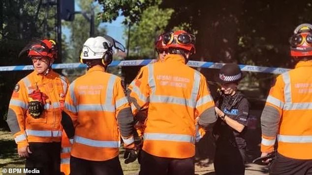 The piano showroom owner, whose business is just off the park, said the boughs of what he estimates is a 200-year-old cedar tree have been supported by struts ever since he was young. Pictured: Emergency services at the scene in the park