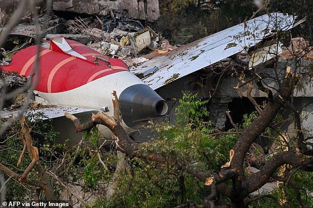 Wreckage showing the tail section of the Air India Boeing 787-8 in a residential area near the airport in Ahmedabad on June 14, 2025