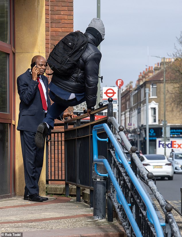 Asolo-Agogua leapt over a railing while wearing a mask and ran away to avoid press reporters after appearing at Bromley Magistrates Court in March