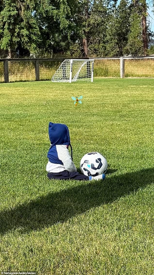 In one recent picture, which was also posted by Hailey, baby Jack sat in lush green grass on a soccer field
