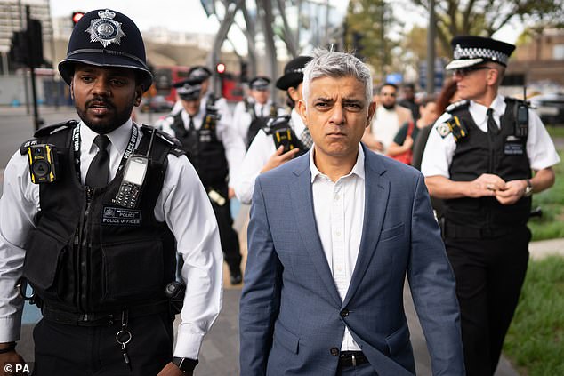 Mayor of London Sir Sadiq Khan (centre) during a visit to Stratford with police in October 2022