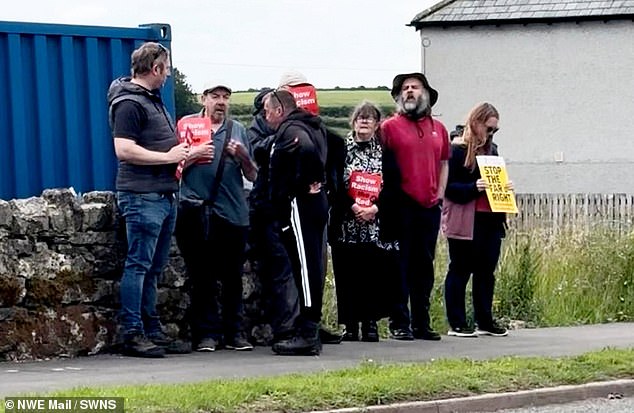 Many held signs reading 'show racism the red card' and 'stop the racism'