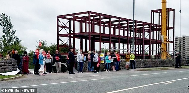 Dramatic scenes show demonstrators going head to head outside the construction site of the controversial mosque in the Lake District on Wednesday