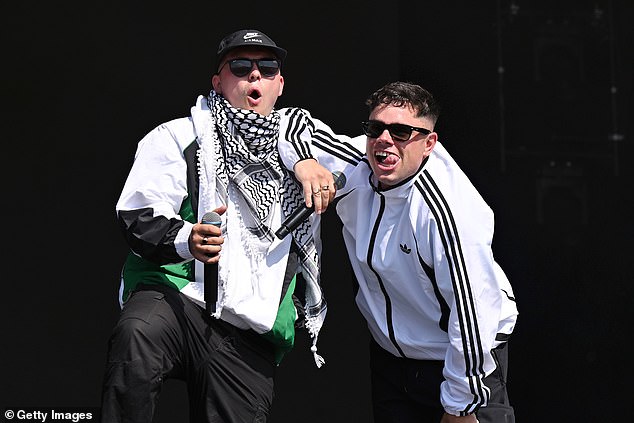 As Kneecap walked onto the stage, they played a compilation of their critics' voices over the speakers. Pictured: Kneecap's set at Glastonbury