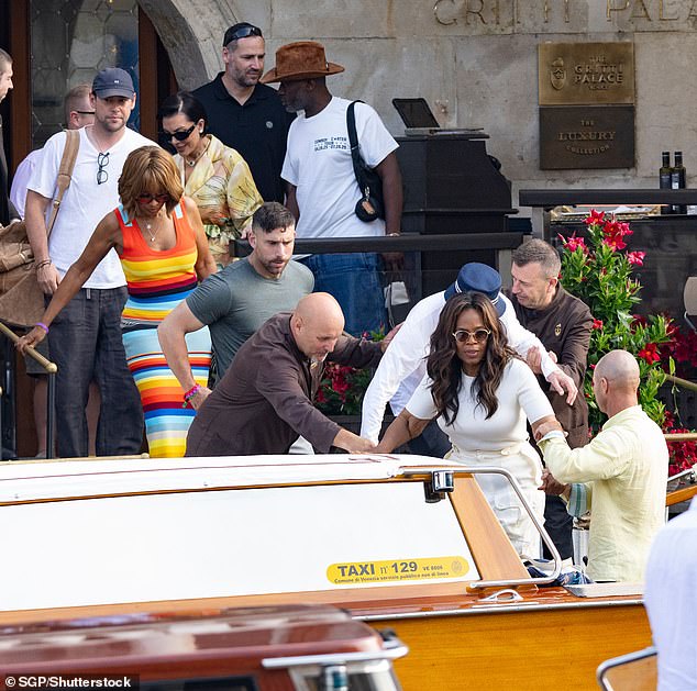 The 71-year-old former talk show host was clad in a ribbed white sweater and ivory cargo pants