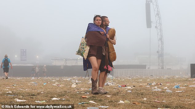 Pictures taken of Worthy Farm this morning show a sea of waste and the final few die hard festival-goers wading through the mess in the same outfits they had on yesterday