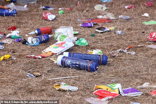 Hundreds of canisters of nitrous oxide - also known as hippy crack - were left strewn across the fields along with paper cups, wrappers and balloons