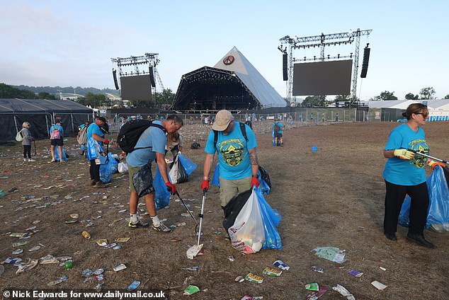 The clean-up team working hard to pick up all the litter and return the site to it original state