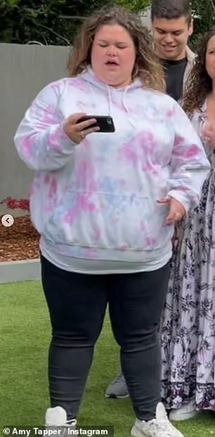 In a mirror selfie in February, she showed how far she'd come, as she donned a jumper that she'd previously worn in 2022 (pictured)
