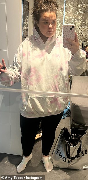 She posed in the same jumper three years later - showing how it was now far too big