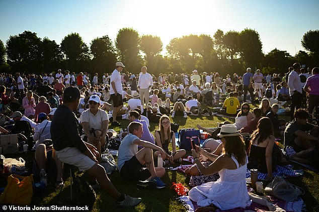 Hundreds waited overnight with Wimbledon telling fans that the queue is 'at capacity'