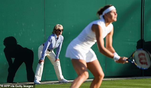 A line judge watches as the Czech Republic's Lucie Safarova plays against France's Oceane Dodin during their women's singles first round match on the second day at Wimbledon in 2017