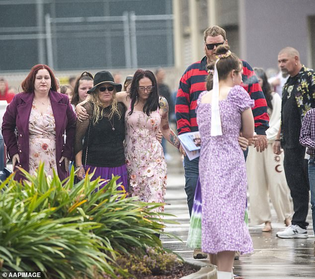 The teenager's mother Kylie Johnson was seen in a pink dress with her arm around another woman