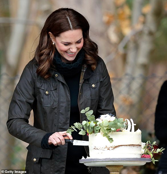 Even Kate thinks it's a laugh. The Princess of Wales takes great care with this cake as she visits  Robin Hood Primary School to celebrate ten years of The Royal Horticultural Society campaign for school gardening in  2017