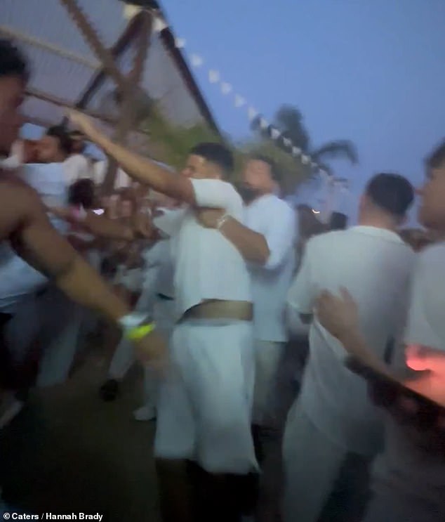 The violent thugs were seen hurling each other around and throwing fists despite efforts from apparent bar staff to dispel the group by throwing ice water on them
