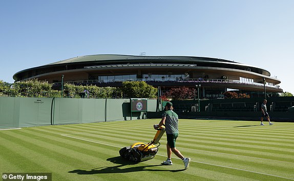 LONDON, ENGLAND - JUNE 30: A groundskeeper mows a court on day one of The Championships Wimbledon 2025 at All England Lawn Tennis and Croquet Club on June 30, 2025 in London, England. (Photo by Ezra Shaw/Getty Images)
