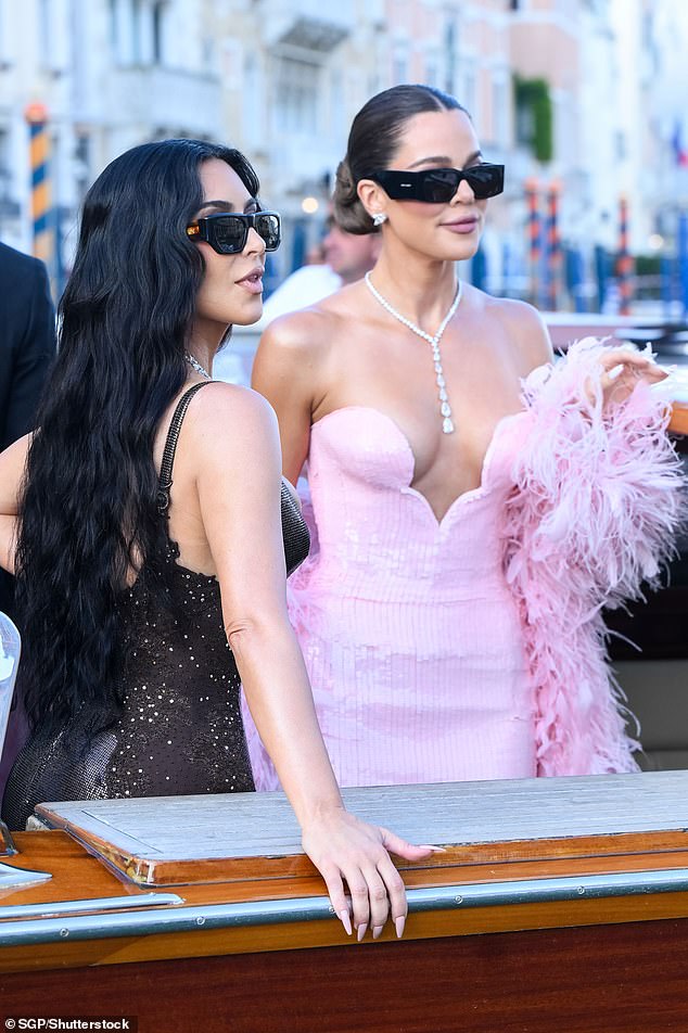 Instead it was the Kardashian sisters who posed up a storm at the wedding - though Kourtney was notably absent. Pictured: Kim and Khloe - Kendall and Kylie also attended