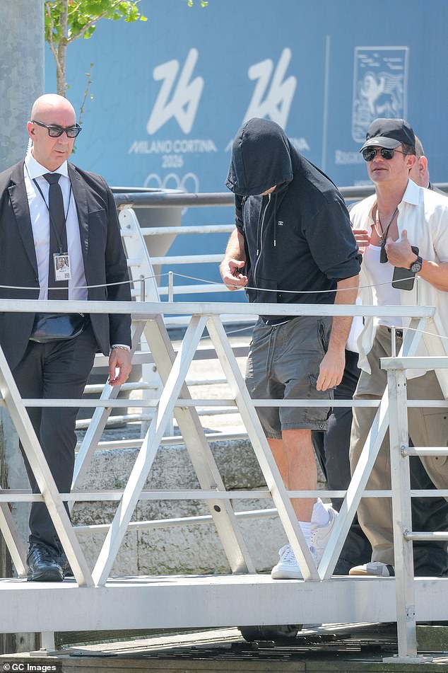Departing Venice on Sunday morning following Saturday night's final party, Leo attempted to keep a low profile by covering his face throughout his journey to the airport