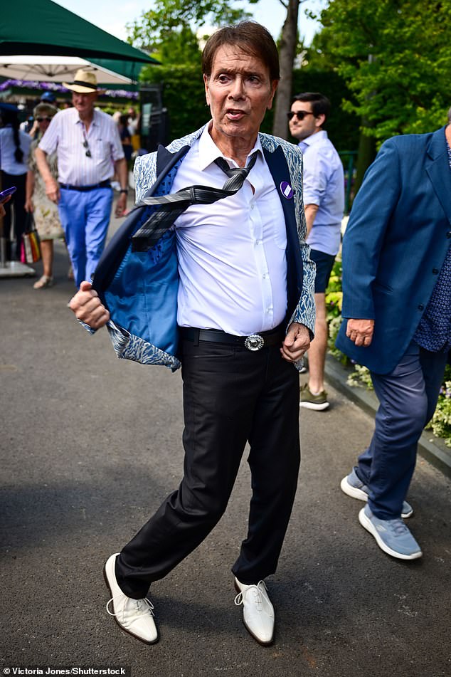 In true tradition, tennis lover Cliff Richard, 84, was also in attendance and looked his usual snazzy self in a colourful blaze
