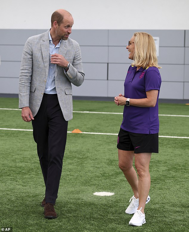 The Prince of Wales in conversation with the England women's manager Sarina Wiegman