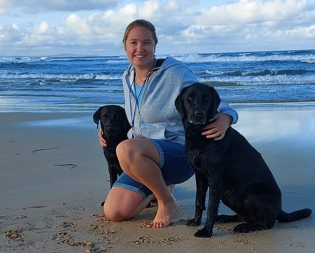 She is now suing the Dogs Trust, where she was assistant operations manager, for more than £200,000 in compensation - she is pictured here with dogs not involved in the incident