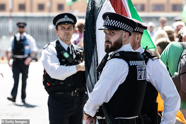 Police are deployed to control the protest on June 30, 2025 in London, England.