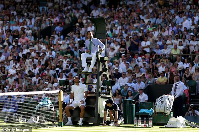 His opponent Fabio Fognini took shelter from the sun in the shadow of the umpire's chair