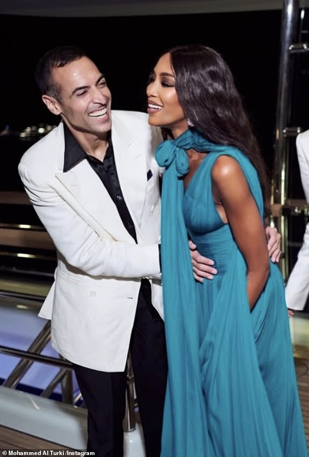 In another snap Naomi was the epitome of chic in a blue Grecian inspired gown