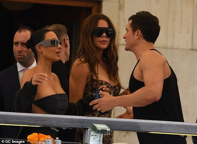 The Pirates Of The Caribbean star also seemed to enjoy some flirty exchanges with Kim Kardashian (left) and her sister Khloe (centre)