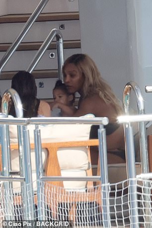 Serena plays with youngest daughter Adira on the yacht