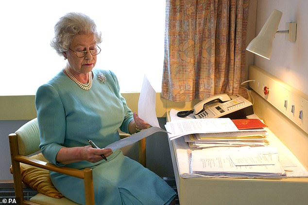 Royal aides were also concerned by the spiralling costs of the liveried locomotive, so beloved by Queen Elizabeth (above, working on the train in 2002)