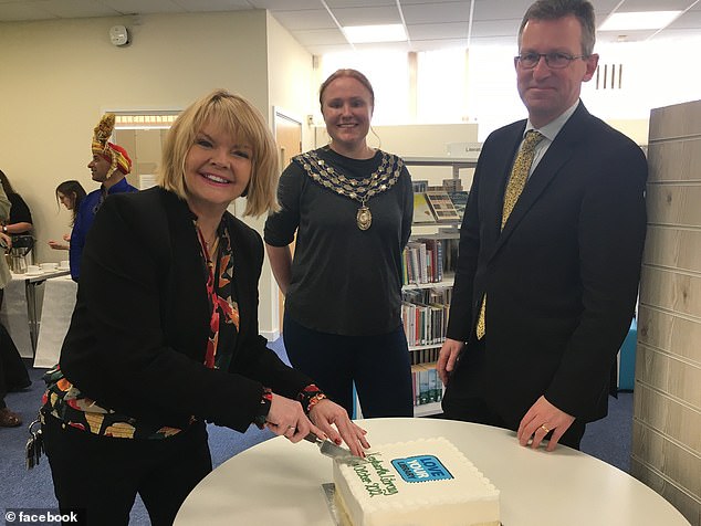 Ms Fogarty said that throughout and before her tenure in the job - for which she is paid between £196,303 and £213,001 - the flags have been flown during Pride month. Pictured: Opening Kenilworth Library with MP Jeremy Wright