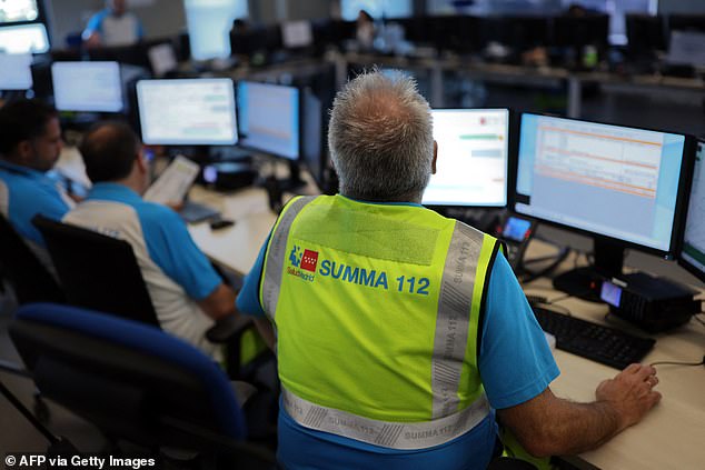 SPAIN: Emergency medical staff in Spain readied to deal with an unexpected surge in heatstroke cases. Pictured: Medical dispatchers wait for calls to Madrid's SUMMA emergency medical services number at the main emergency call centre for the whole Madrid region, in Valdebebas, on the outskirts of Madrid, on June 26