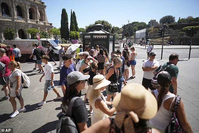 ITALY: Elsewhere queues form for public fresh drinking water stations in the Italian capital on Monday