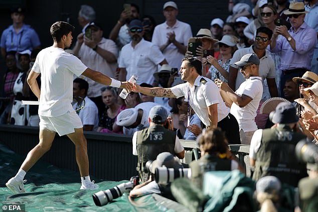 WIMBLEDON: Carlos Alcaraz hands over his water bottle after a spectator fainted due to the hot weather on Monday