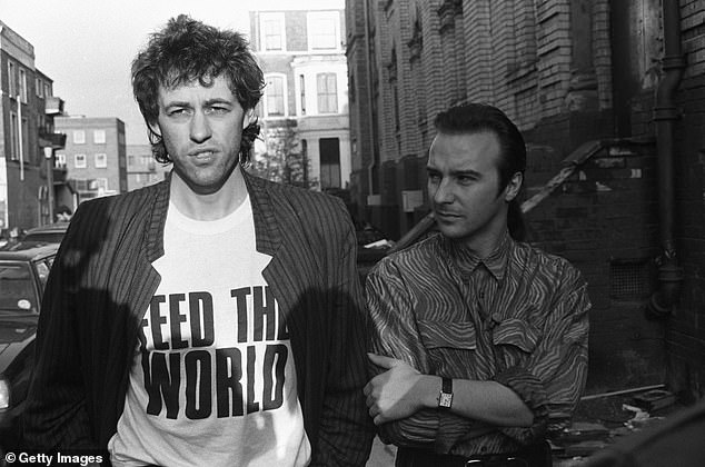 It is none other than Ultravox, Thin Lizzy and Visage star Midge Ure, who co-wrote and produced the iconic festive tune Do They Know It's Christmas (pictured right in 1984 with Bob Geldof)