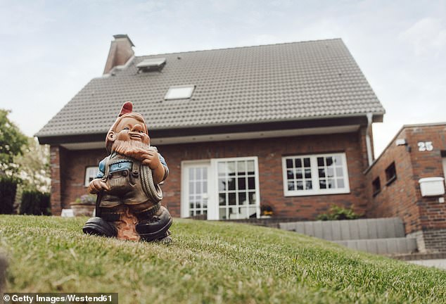 Collecting garden gnomes has become a peculiarly popular British hobby and always provides a treat for passersby but they might not be as much fun for neighbours (Stock Photo)