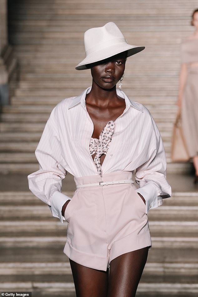 A model walks the runway during the Max Mara Cruise fashion show on June 17