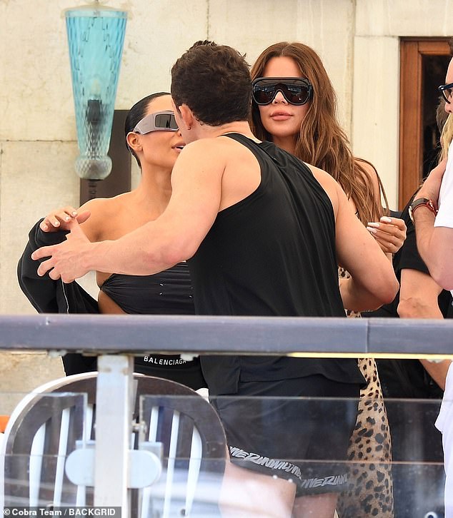 Upon arrival in Venice, Bloom was seen embracing and air-kissing Kim Kardashian, with pictures circulating round the world. Her sister Khloe stands next to the pair