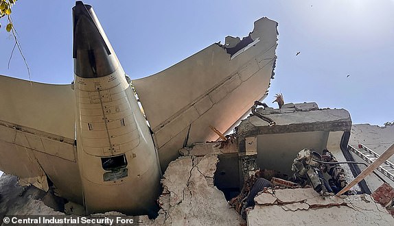 This handout taken and posted on the X (formerly Twitter) account of the Central Industrial Security Force (CISF) On June 12, 2025 shows the back of AN Air India plane after it crashed in a residential area near the airport in Ahmedabad. The London-bound Air India flight 171 passenger plane crashed on June 12 in India's western city of Ahmedabad with 242 on board, aviation officials said in what the airline called a "tragic accident". (Photo by Handout / CENTRAL INDUSTRIAL SECURITY FORCE (CISF) / AFP) / -----EDITORS NOTE --- RESTRICTED TO EDITORIAL USE - MANDATORY CREDIT "AFP PHOTO / CENTRAL INDUSTRIAL SECURITY FORCE (CISF)  " - NO MARKETING - NO ADVERTISING CAMPAIGNS - DISTRIBUTED AS A SERVICE TO CLIENTS (Photo by HANDOUT/CENTRAL INDUSTRIAL SECURITY FORCE (CISF)/AFP via Getty Images)