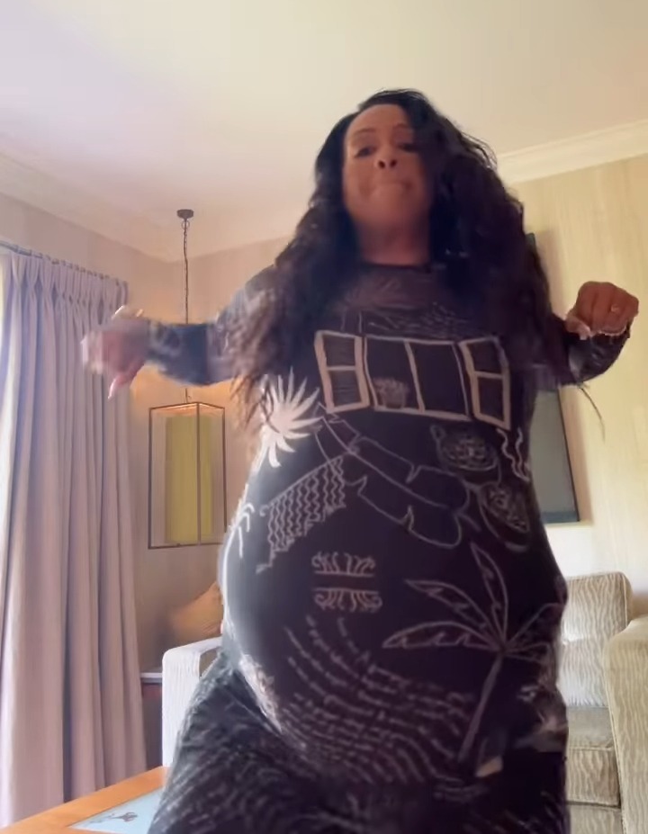 Alison Hammond in a patterned dress, playfully addressing pregnancy rumors.