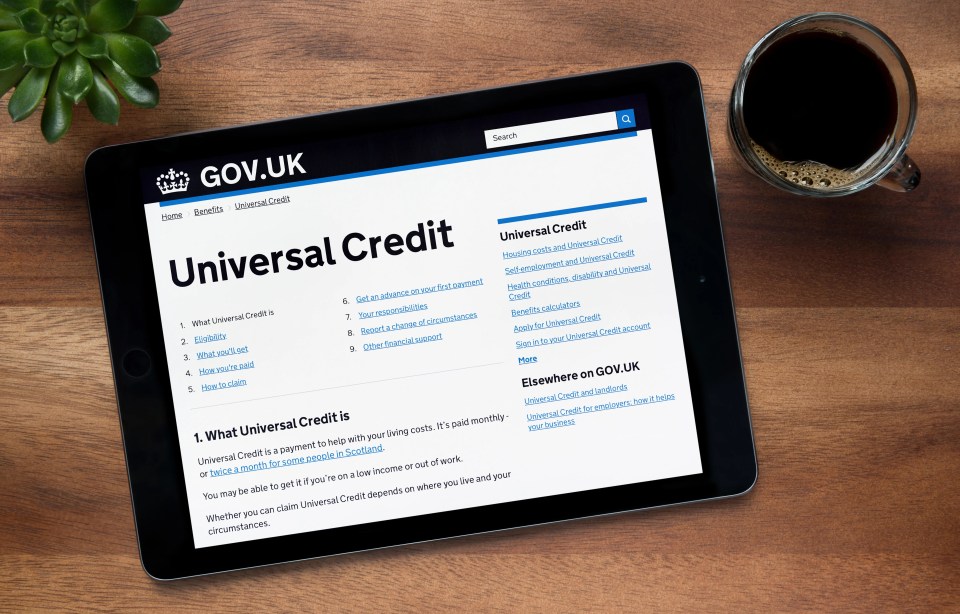 iPad displaying the UK government website's Universal Credit page.