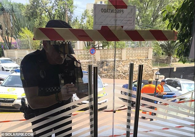British holidaymakers staying at a four-star hotel in Spain have been prevented from leaving via the front door - after local police said it was not conforming with tourism regulations
