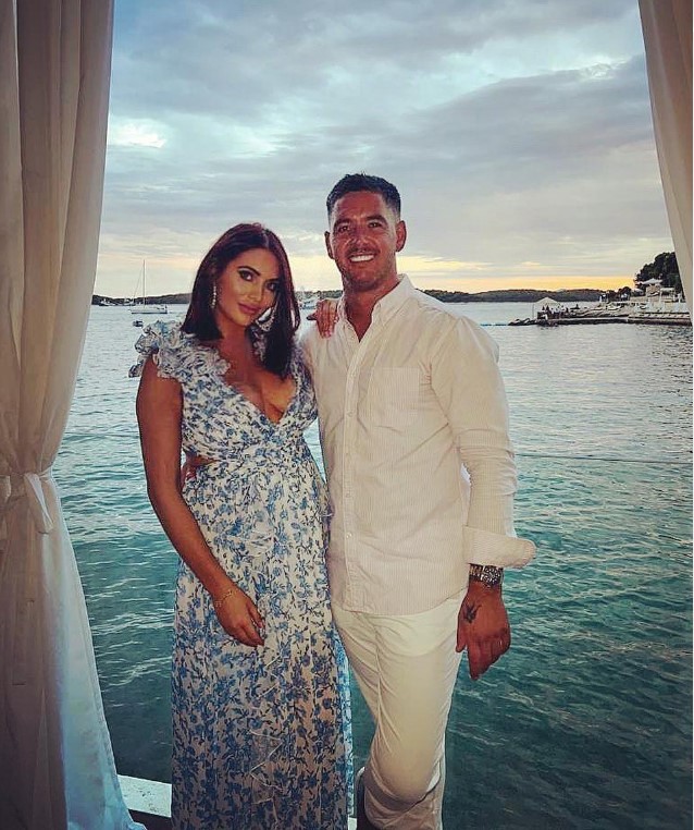 Amy Childs and a man by the water.