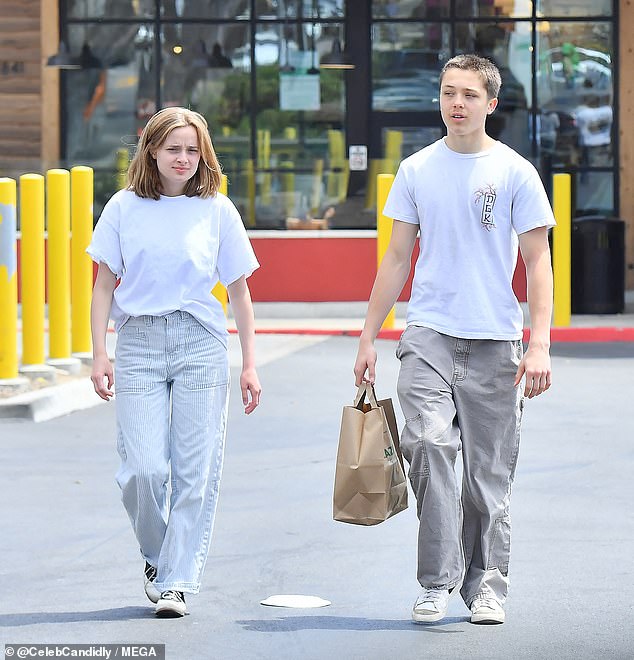 Angelina Jolie and Brad Pitt's twins Vivienne and Knox, 16, were the spitting image of their famous parents as they stepped out in LA recently